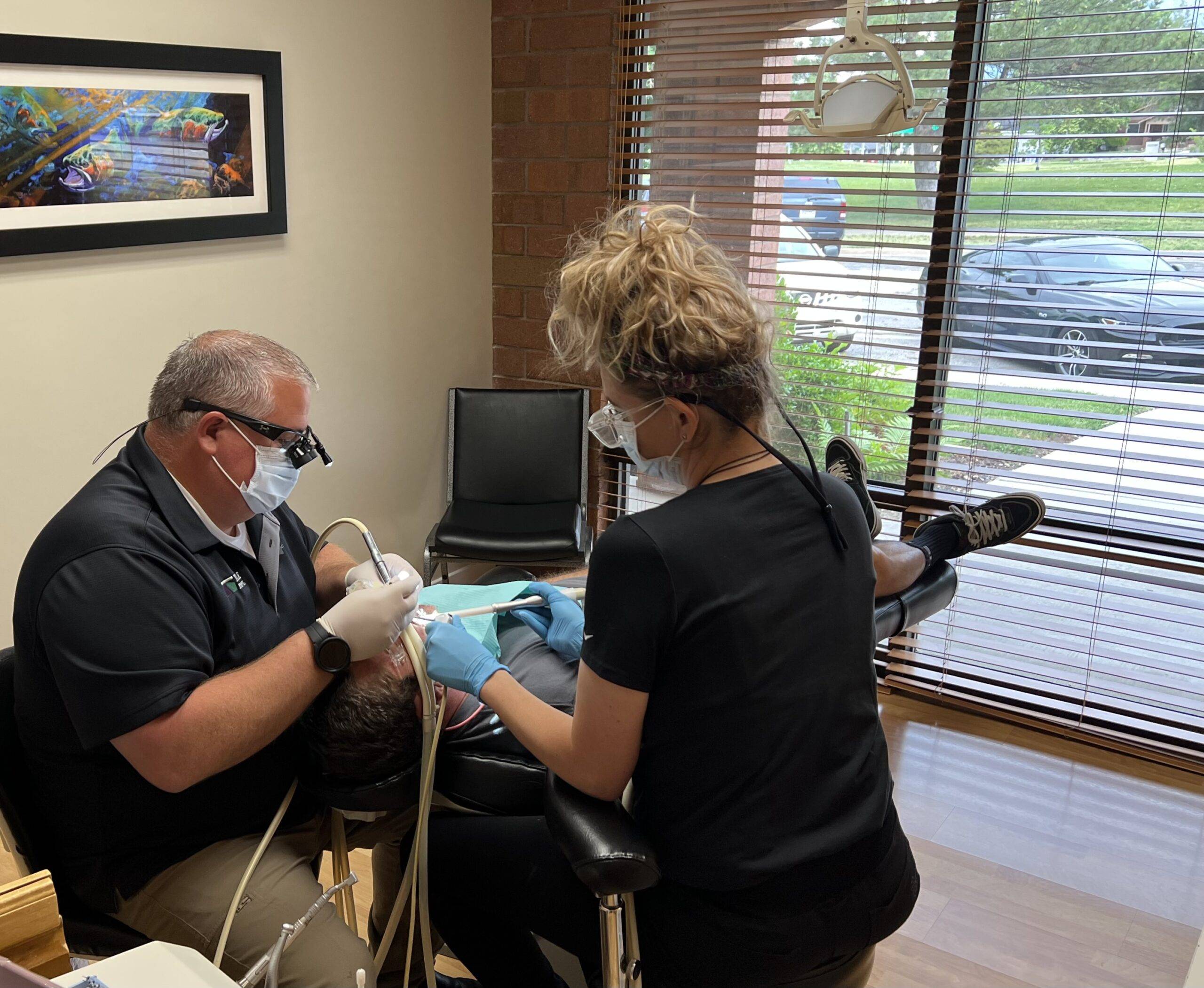 Dentist performing the Dental Procedure